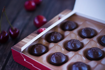 Chocolate sweets with cherry liqueur in a box.