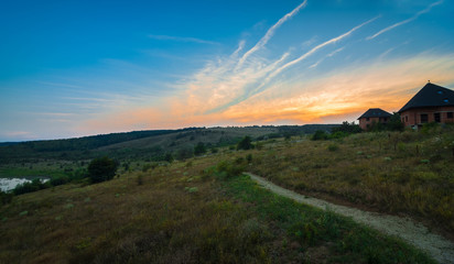 Naklejka na ściany i meble Mountains during sunset. Beautiful natural landscape in the summer time.