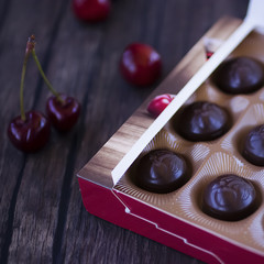 Chocolate sweets with cherry liqueur in a box.