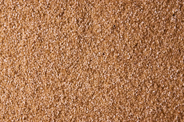 Sesame seeds background texture, close-up. View from above, horizontal 