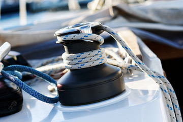 Winch with rope on sailing boat