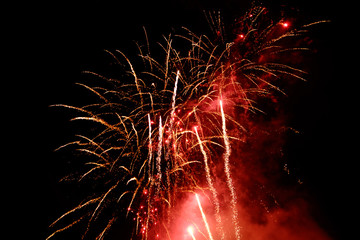 red fireworks in black night sky