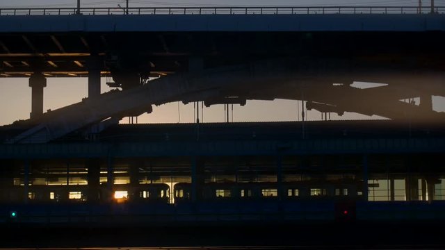 the train stops at the metro station, by the rays of the setting sun