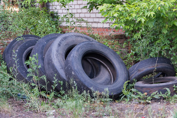 old worn tires are a big pile in a landfill