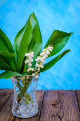 Lily of the valley bouquet in a transparent vase