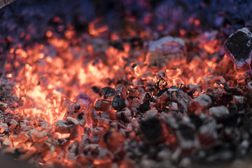 Burning charcoal with a shallow depth of field.