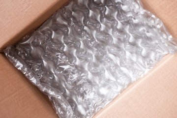 Plastic wrap with big bubbles in carton box
