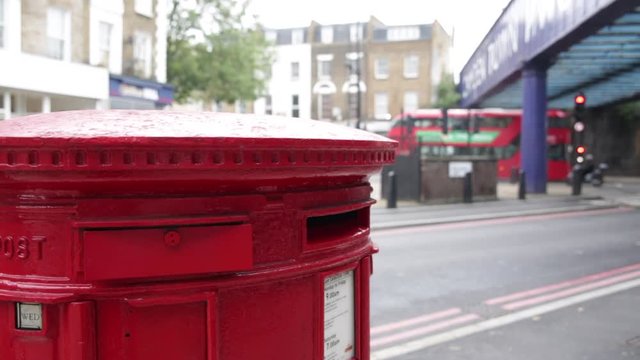Red post box and a Red bus in London