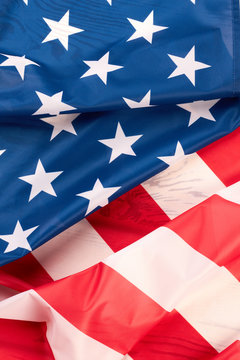 American flag close up. Stars and stripes satin flag background. USA flag wallpaper.