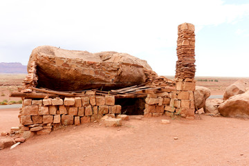 A desolate rock house near Vermilion cliffs. This meagre lean-to was built by Blanche Russell in...