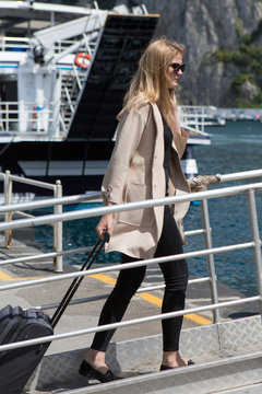 Young woman boarding the ferry