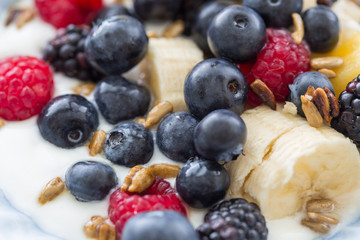 Plate of mixed fruits with yogurt