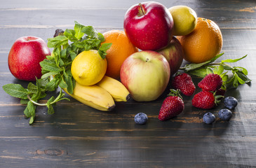 dietary healthy food fresh fruit and berries on a wooden table