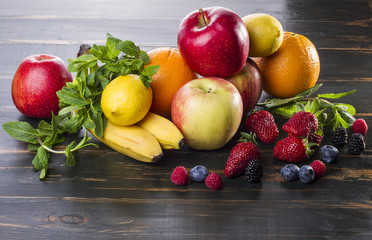 dietary healthy food fresh fruit and berries on a wooden table