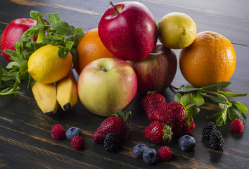 dietary healthy food fresh fruit and berries on a wooden table
