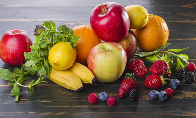 dietary healthy food fresh fruit and berries on a wooden table