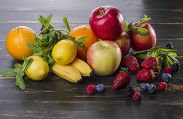 dietary healthy food fresh fruit and berries on a wooden table