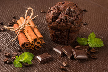 chocolate muffin with cinnamon sticks