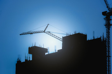 Silhouette City worker, construction crews to work on high ground heavy industry