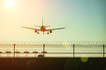 Passenger plane flying in the blue sky goes on takeoff