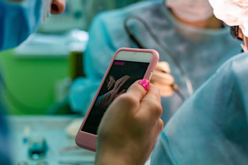 Surgeons operating a patient in operating room