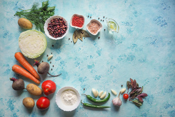 Vegetables ingredients for borscht on the kitchen table. Homemade Russian, Ukrainian and Polish national soup - red borscht.