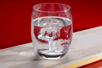 Sparkling mineral drink water in glasses served on table with lemon copy space