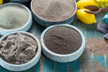 Ancient nature minerals, different types of clay used for skincare, spa treatments, face masks, gray, black, green and blue mud, close up