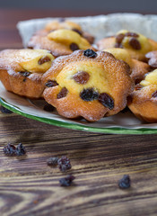 Traditional homemade French butter muffins stars with raisins, tasty dessert