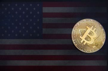 gold bitcoin against the background of the American flag, dollars and wallet