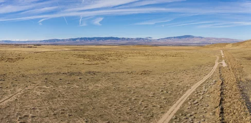 Foto op Canvas Panorama of dry desert plain during the California drought in central plain. © kenkistler1
