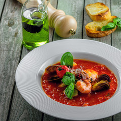 Delicious Italian tomato seafood on a table. Plate of classic healthy vegetable food.