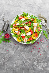 Chicken salad. Meat salad with fresh tomato, sweet pepper, arugula and grilled chicken breast. Chicken fillet with fresh vegetable salad