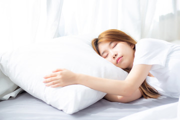 Fototapeta na wymiar Portrait of beautiful asian young woman sleep lying in bed with head on pillow comfortable and happy with leisure, girl with relax for health and lifestyle concept.