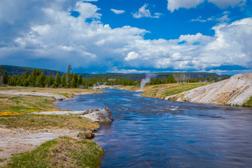 Fototapeta na wymiar Gorgeous outdoor view of firehole river in the Yellowstone national park