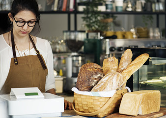 Bakery shop owner standing at counter