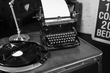 Old typewriter and a coil with a film.