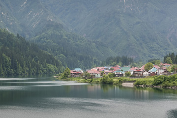 Fototapeta premium The surrounding mountains and the houses of the Oshi Shuraku village at Onuma District , Fukushima prefecture.