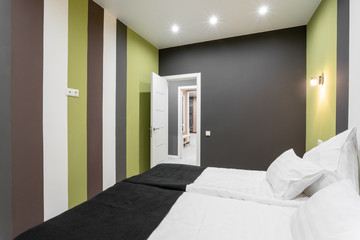 Hotel standart room. modern bedroom with white pillows. simple and stylish interior. interior lighting