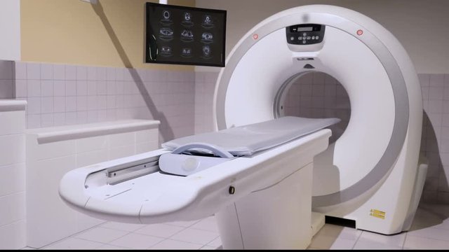 CT Scan or CT Scanner in a new hospital. Hospital equipment with nobody. 
4k pan shot. 
