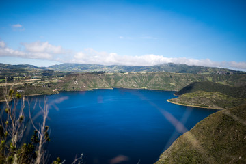 Obraz premium Panoramic of Cuicocha, beautiful blue lagoon inside the crater of Cotacachi volcano near Otavalo