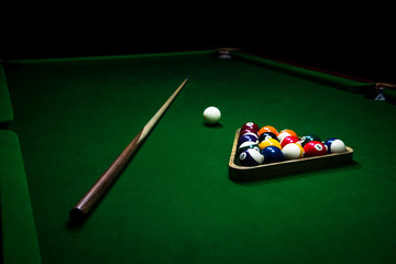 Billiards balls on the green table