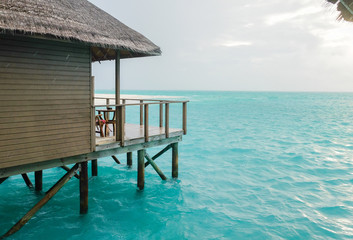 Water villa with blue ocean sea at Maldives island
