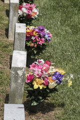 headstones with floral bouquets