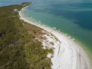 Fototapeta na wymiar beach aerial drone above view white sand boats sea water island