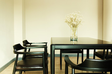 Modern design wooden table set with decoration flower in the jar, vintage tone