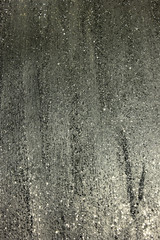 Gray shiny textured acrylic paint with glitter background