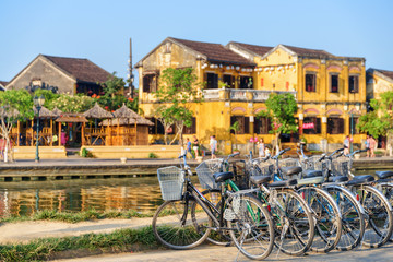 Fototapeta na wymiar Bicycles parked beside the Thu Bon River, Hoi An
