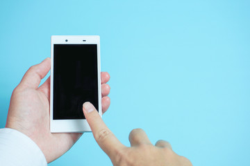 Using mobile phones in business scene.  スマートフォンを使う　水色背景