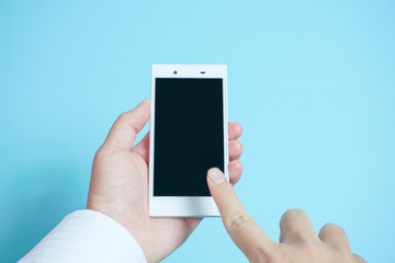 Using mobile phones in business scene.  スマートフォンを使う　水色背景